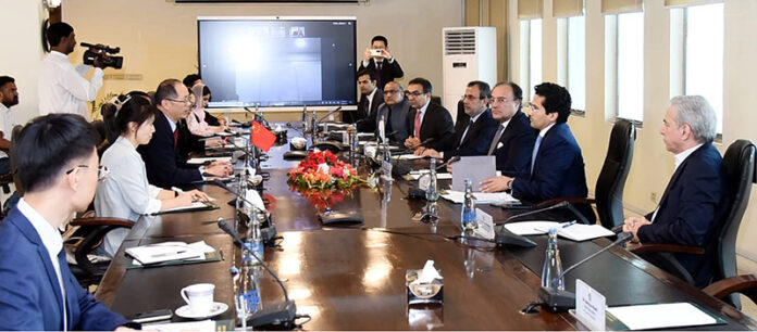 Federal Minister for Finance and Revenue Senator Muhammad Aurangzeb in a meeting with Charge D'affaires Mr. Shi Yuanqiang and other officials of the Embassy of People's Republic of China