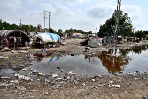 A view of rain water accumulated front of huts at Makki shah area.
