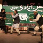 Artist performing on stage in a drama Titled,(Gwah Rehna) in connection with Independence Day celebrations at Sargodha Arts Council