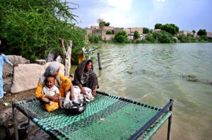 Slum area submerged in river water near River Indus.