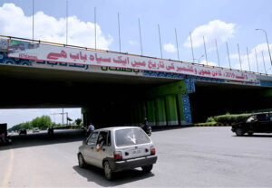 A large banner hangs over the Zero Point Bridge in Federal Capital, observing a commemorating 5 August 2019 as a Black Day in the history of Jammu and Kashmir.