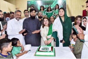 Assistant Commissioner Anum Babar and Government College Women University Vice Chancellor Dr. Zareen Fatima Rizvi cutting the cake at the Independence Day celebration at GCWUS