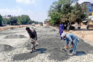 Laborers are hard at work, fixing and repairing Main Walton Road in the Provincial Capital.