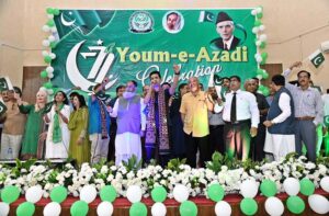 Singer Ahad Khan performing a national song during a Function in connection with upcoming 77th Independence Day Celebrations at Chandka Medical College Auditorium Hall.