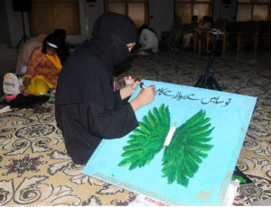 A woman looks at rare tickets at GPO Multan on the occasion of Independence Day.