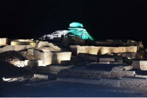 An eye catching view of Stoppa a spot at Mohenjo-daro (Mound of dead) remains of the most impressive city of the Indus Valley Civilization, decorated with national flag colorful lights to commemorate the Independence Day of Pakistan