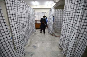 Paramedical staff prepare an isolation ward set up as a preventative measure following Pakistan's health ministry has confirmed a case of Mpox in the KP, at a Police & Services Hospital.