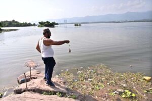 A man fishing at Rawal Lake near Bani Gala