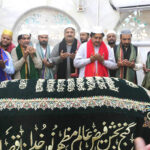 Acting Governor Punjab Malik Ahmad Khan is praying at the Shrine of Data Darbar after placing the Charad