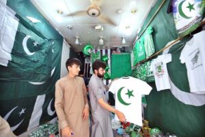 A garment vendor selling a beautiful outfits for tiny Patriots with big style on upcoming celebrating Independence Day, 14th August, at Qissa Khawani Bazar.