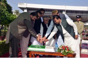 Deputy Prime Minister Ishaq Dar cuts cake during the flag hoisting ceremony at the lawn of Balochistan Assembly to mark the Independence Day, CM Balochistan Mir Sarfaraz Bugti, Speaker National Assembly Sardar Ayaz Sadiq and federal commerce minister Jam Kamal are also present
