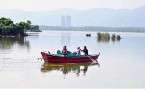 A man fishing at Rawal Lake near Bani Gala