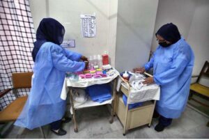 Paramedical staff prepare an isolation ward set up as a preventative measure following Pakistan's health ministry has confirmed a case of Mpox in the KP, at a Police & Services Hospital.