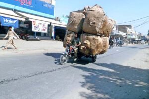 An overloaded tricycle on the road requires immediate attention from authorities.