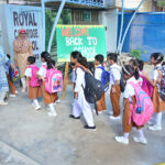 Students return to school in Latifabad, ready to resume classes after a long summer break