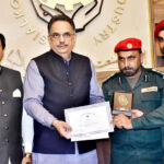 Group photo of President Chamber of Commerce Abdul Ghafoor Malik, Syed Kamal Abid Divisional Emergency Officer presenting awards to the Rescue 1122 officers