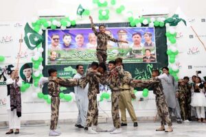 Students Performing Tableau during 77th Independence Day Celebrations at Begum Nusrat Bhutto auditorium Hall Jinnah Bagh