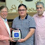 The business community cuts a cake at a special ceremony at Sialkot Chamber of Commerce and Industry (SCCI) in honor of Arshad Nadeem's historic Gold Medal win in the Javelin throw at the Paris Olympics 2024