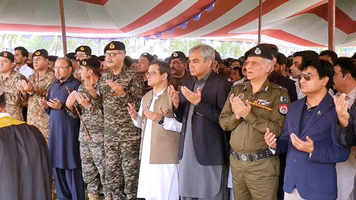 Federal Minister for Interior Mohsin Naqvi offering Fateha for the martyred police personnel
