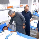Federal Minister for Interior Mohsin Naqvi inquiring about the health of an injured police personnel