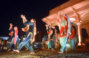 Artists Performing on stage during Mango Festival organized by authority of Walled City.
