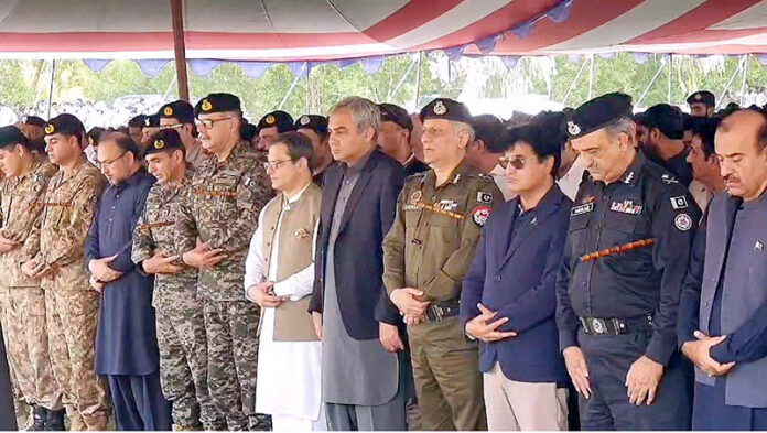 Federal Minister for Interior Mohsin Naqvi attending funeral prayer of martyred police personnel