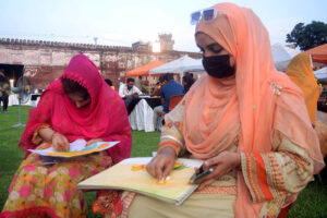 Artists Performing on stage during Mango Festival organized by authority of Walled City.