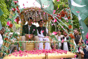 Governor Khyber Pakhtunkhwa Faisal Karim Kundi and Olympics Gold Medalist Arshad Nadeem along with other officials cutting the cake of Independence Day at Governor House