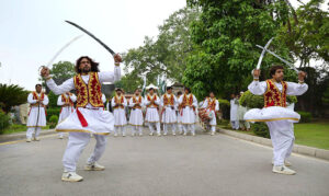Artists performing traditional Khattak dance during the hosting ceremony of Arshad Nadeem (Olympics Gold Medalist) at Governor House