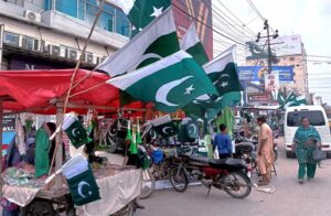 A vendor displays national flags, badges, and other items as the nation prepares to celebrate Independence Day in a befitting manner.