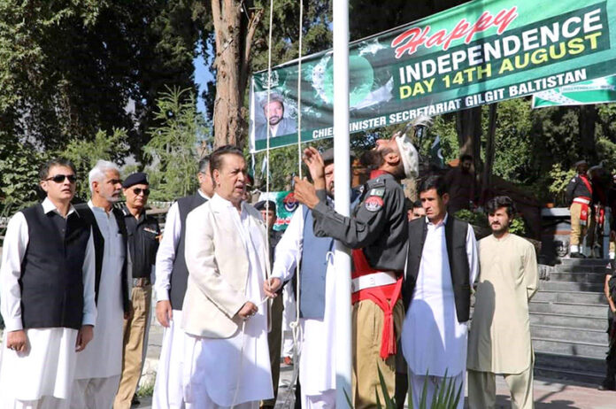 Governor Gilgit-Baltistan Syed Mehdi Shah and Chief Minister Gilgit-Baltistan, Haji Gulbar Khan hoisting flag at Yadgar-e-Shohda to mark the 77th Independence Day of Pakistan