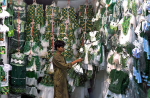 A vendor displays national flags, badges, and other items as the nation prepares to celebrate Independence Day in a befitting manner.