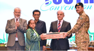 Prime Minister Muhammad Shehbaz Sharif and Chief of Army Staff General Syed Asim Munir distributing laptops among the high achievers during National Youth Convention.