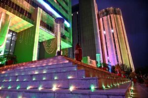 An illuminated view of the OGDCL building decorated with colorful lights in connection with the Independence Day celebration.