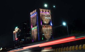 An illuminated view of the OGDCL building decorated with colorful lights in connection with the Independence Day celebration.