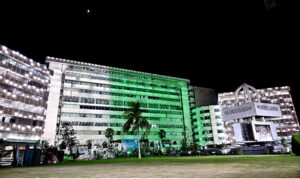 A view of the Civic Center building illuminated with lights on the eve of Independence Day celebrations