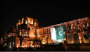 A view of the Civic Center building illuminated with lights on the eve of Independence Day celebrations
