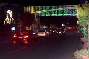 Mall Road illuminated with green and white lights for the 77th Independence Day celebration.