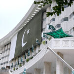 Pakistani flag is placed on WAPAD House building on Independence Day commemoration