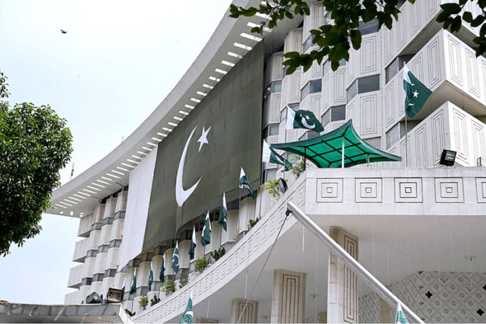 Pakistani flag is placed on WAPAD House building on Independence Day commemoration