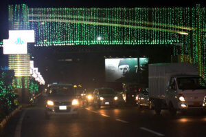 Mall Road illuminated with green and white lights for the 77th Independence Day celebration.