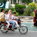 On Independence Day, commuters decorated their vehicles with Pakistani flag on Mall Road