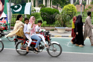 On Independence Day, commuters decorated their vehicles with Pakistani flag on Mall Road