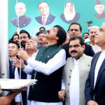 Governor Punjab Sardar Malik Salim Haider hoists the national flag on the Independence Day of Pakistan at Governor House