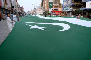 Pakistan Markazi Muslim League displays 1 km long national flag to commemorate the Independence Day on Sadar Road