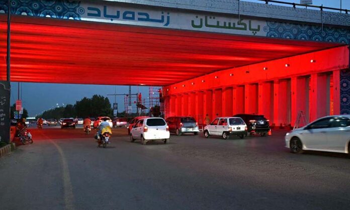 A view of newly installed colorful lights under a bridge at Zero Point in Federal Capital
