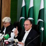 Federal Minister for Finance and Revenue Senator Muhammad Aurangzeb addressing a press conference at PTV Headquarter