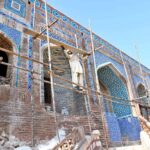 A laborer busy in construction work of Historic legacy of Seven Sisters Graveyard (Satin Jo Asthan Graveyard) Wall, dating back to the Mughal era during the reign of Abul-Qasim Namkin, the esteemed Ameer of Sukkur. In the early 11th Hijra, he arrived in Bakhr, where Mughal King Akbar granted him Jageer. A connoisseur of literature and art, Abul- Qasim Namkin later transformed the hill into a family cemetery, embellishing it with four minarets and corners. Before becoming a graveyard, this location hosted gatherings, meetings and events aptly named "Safae Safa." Referenced in the book "History of Sukkur" by Sindh's renowned historian Rahmidad Molai Shidai, the first grave of Abul-Qasim Namkin was established in 1018 Hijra. The architectural style of the tombs reflects Mughal and Tarkhan influences, adorned with intricate engravings. Legend has it that this site holds stories of seven women seeking refuge from tyrants. Upon reaching this sacred place, they found sanctuary in the mountain, disappearing into its depths. Although lacking historical references, some believe it to be the dwelling of seven elders or elderly women. Today, it stands as a captivating historical site nestled between Sukkur and Rohri at Left Bank of Indus River. Constructed on the mountain in the 17th Hijra, from 1018 AH to 1070 AH (equivalent to 1609 AD to 1659 AD), these tombs showcase small minarets and platforms attached to the hill, with covered floors. Predominantly belonging to the family of Mir Abul-Qasim Namkin, other hills nearby also house graves of notable personalities from that era