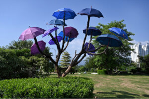 Passers by looking at the wall painting at Rawal Chowk Interchange