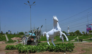 An attractive view of fiber made horse module installed at Karal Chowk on Islamabad Expressway.